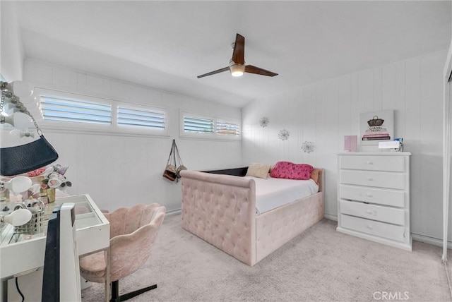 bedroom with ceiling fan and light carpet