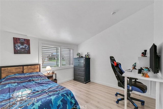 bedroom featuring baseboards and light wood-style floors