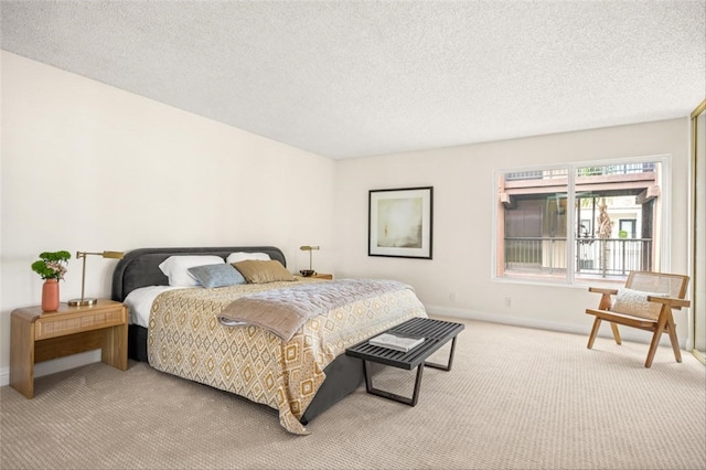 4050 Via Dolce Unit 241, Marina Del Rey, CA 90292 - bedroom featuring carpet floors, baseboards, and a textured ceiling