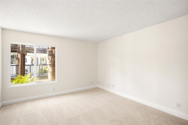 4050 Via Dolce Unit 241, Marina Del Rey, CA 90292 - unfurnished room featuring light carpet, baseboards, and a textured ceiling