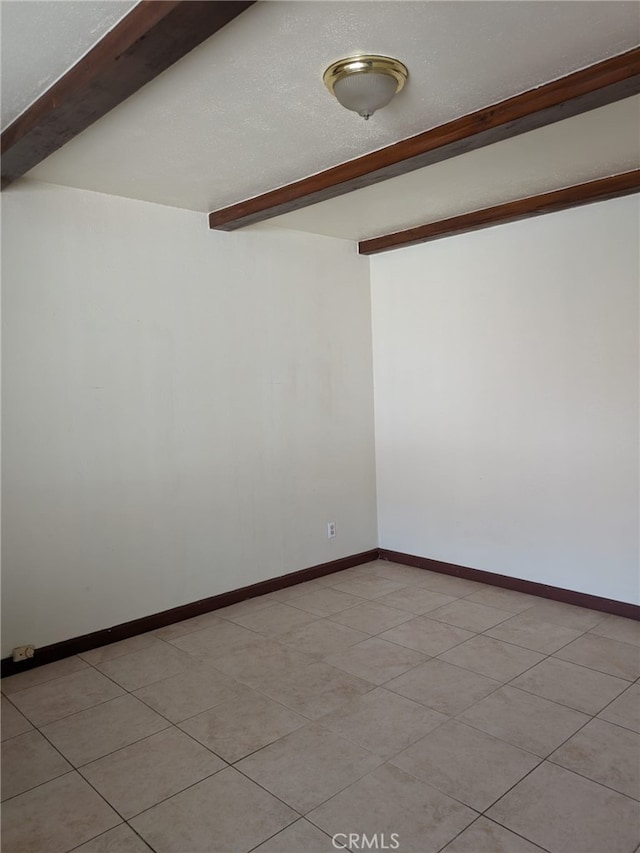 2912 Santa Ana St, South Gate, CA 90280 - empty room with baseboards and beam ceiling