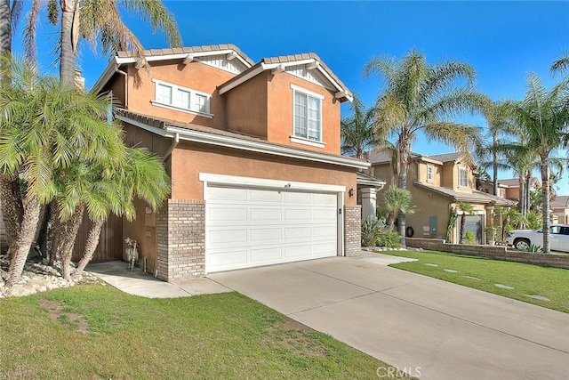 traditional home featuring brick siding, a garage, driveway, stucco siding, and a front lawn