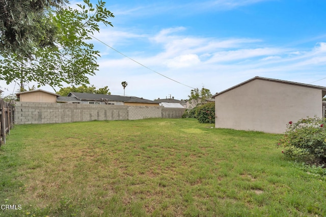 view of yard with a fenced backyard