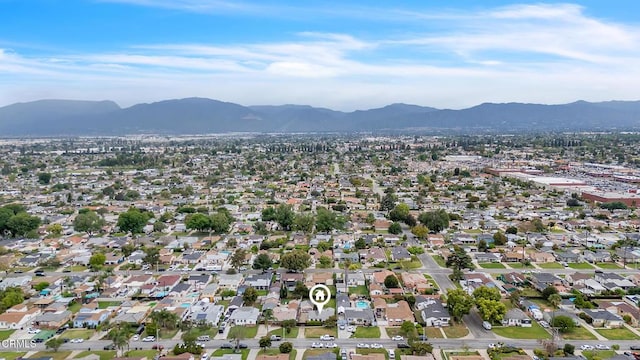birds eye view of property with a mountain view