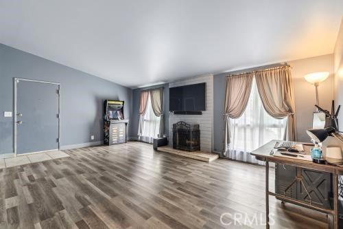 1230 Kilson Dr, Santa Ana, CA 92707 - living room with wood finished floors and a large fireplace
