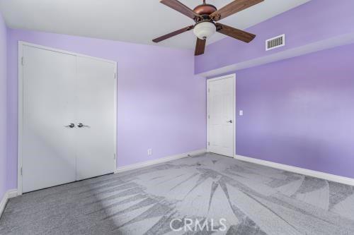 1230 Kilson Dr, Santa Ana, CA 92707 - unfurnished bedroom with carpet flooring and ceiling fan