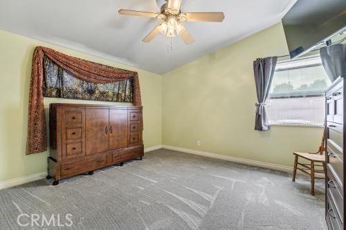 1230 Kilson Dr, Santa Ana, CA 92707 - unfurnished bedroom featuring carpet and a ceiling fan