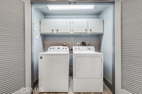 1230 Kilson Dr, Santa Ana, CA 92707 - laundry room featuring washer and dryer and cabinet space