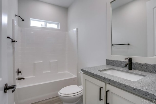 full bathroom featuring vanity, toilet, and shower / washtub combination