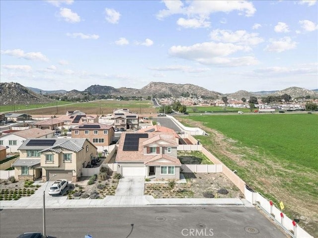 birds eye view of property with a residential view and a mountain view