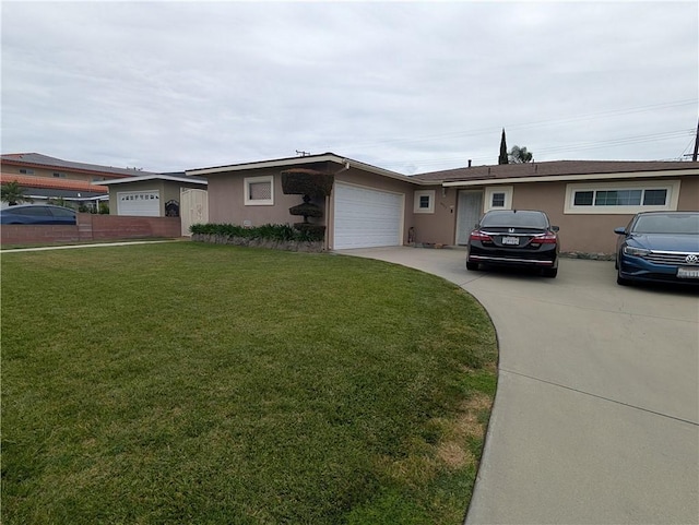 ranch-style house featuring an attached garage, a front lawn, driveway, and stucco siding