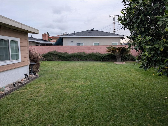 view of yard with fence