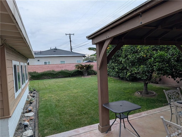 view of yard with fence and a patio area
