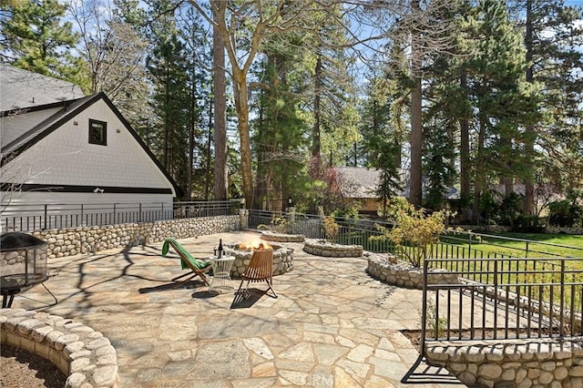 693 Old Meadow Pl, Lake Arrowhead, CA 92352 - view of patio featuring a fenced backyard and an outdoor fire pit