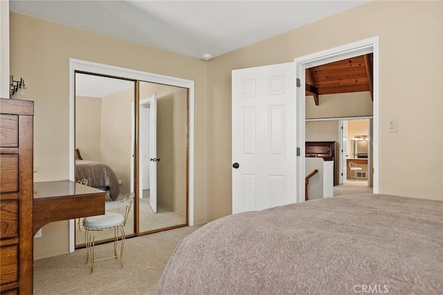 693 Old Meadow Pl, Lake Arrowhead, CA 92352 - bedroom with carpet floors, vaulted ceiling with beams, and a closet