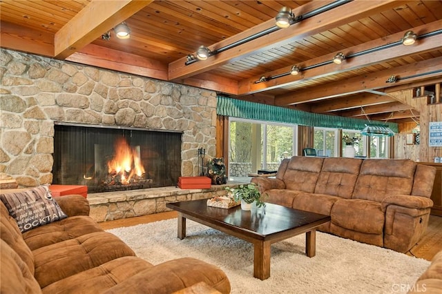 693 Old Meadow Pl, Lake Arrowhead, CA 92352 - living room with beamed ceiling, wooden ceiling, wood finished floors, and a fireplace