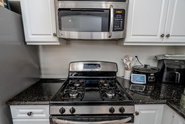 35806 Springvale Ln Unit 2, Murrieta, CA 92562 - kitchen featuring stainless steel appliances, white cabinetry, and dark stone countertops