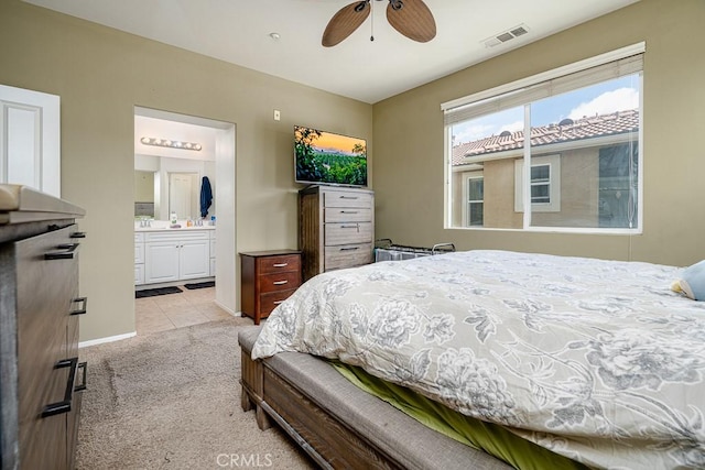 35806 Springvale Ln Unit 2, Murrieta, CA 92562 - bedroom featuring light colored carpet, baseboards, connected bathroom, light tile patterned floors, and a ceiling fan