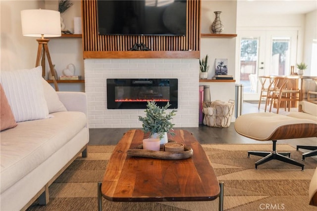 living area with wood finished floors and a fireplace