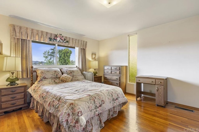1170 Avocado Ave, Escondido, CA 92026 - bedroom featuring wood finished floors and visible vents