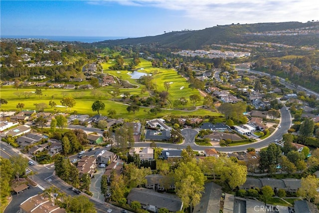 bird's eye view featuring a water and mountain view, a residential view, and golf course view