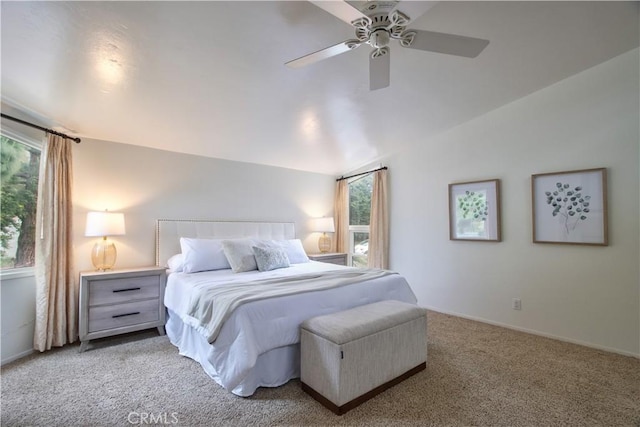 bedroom with lofted ceiling, carpet, a ceiling fan, and baseboards