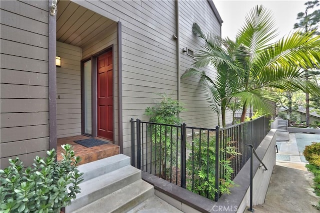 property entrance with fence