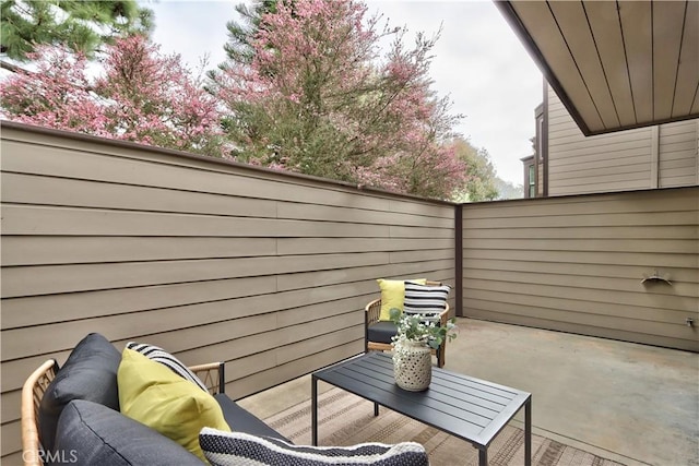 view of patio featuring fence