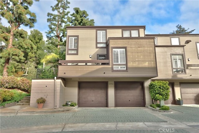 view of front of property featuring driveway and an attached garage