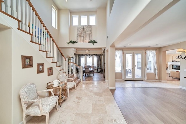 1961 W Snead St, La Habra, CA 90631 - foyer entrance with french doors, stairway, plenty of natural light, baseboards, and a towering ceiling