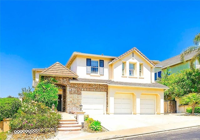 1961 W Snead St, La Habra, CA 90631 - traditional home featuring an attached garage, stucco siding, concrete driveway, and a tile roof