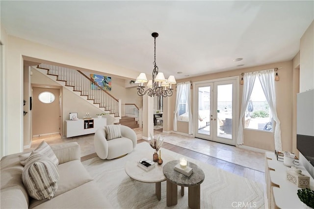 1961 W Snead St, La Habra, CA 90631 - living area with stairs, french doors, a chandelier, and baseboards