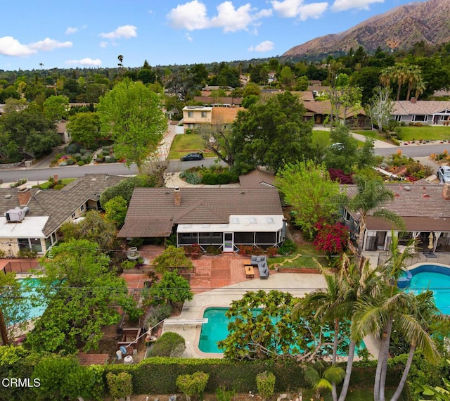 birds eye view of property with a mountain view and a residential view