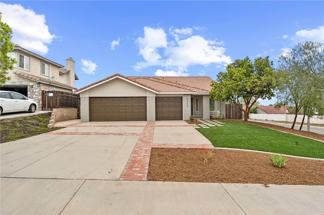 8563 Yarrow Ln, Riverside, CA 92508 - view of front of house featuring a garage, driveway, a tiled roof, and stucco siding