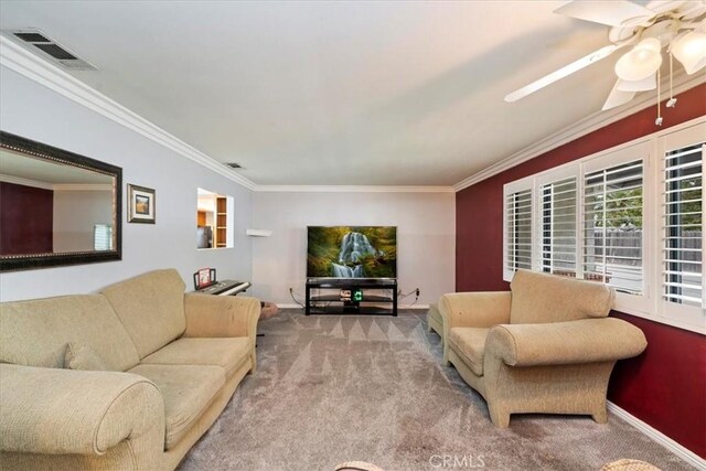 4423 N Sunflower Ave, Covina, CA 91724 - living room with visible vents, a ceiling fan, ornamental molding, carpet floors, and baseboards