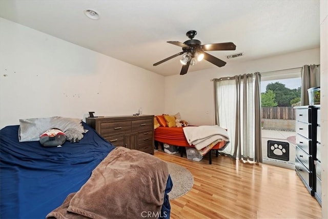 4423 N Sunflower Ave, Covina, CA 91724 - bedroom with light wood-type flooring, visible vents, ceiling fan, and access to exterior