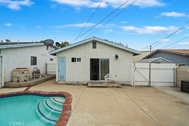 4423 N Sunflower Ave, Covina, CA 91724 - rear view of house with a gate, a patio area, and stucco siding