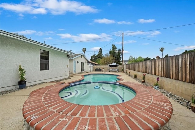 4423 N Sunflower Ave, Covina, CA 91724 - view of pool featuring a pool with connected hot tub, a patio, and a fenced backyard