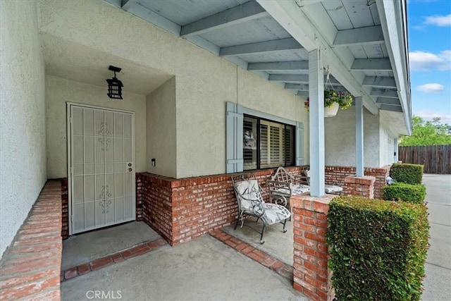 4423 N Sunflower Ave, Covina, CA 91724 - entrance to property with stucco siding, fence, a porch, and brick siding