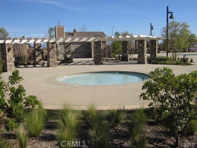 view of swimming pool featuring a patio and a swimming pool