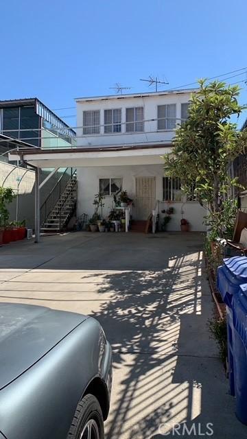 3940 City Terrace Dr, Los Angeles, CA 90063 - rear view of property with stairs and stucco siding