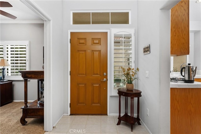 40310 Via Tonada, Murrieta, CA 92562 - entrance foyer featuring a ceiling fan, baseboards, and ornamental molding