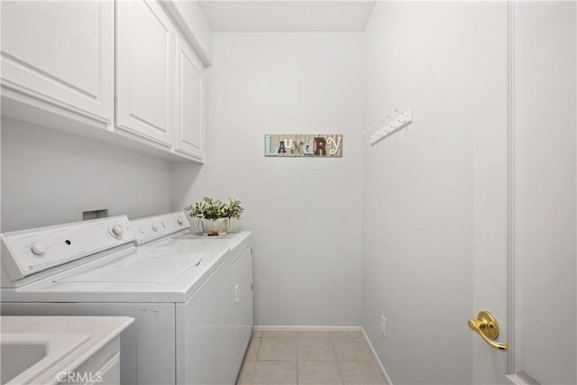 40310 Via Tonada, Murrieta, CA 92562 - clothes washing area with baseboards, independent washer and dryer, light tile patterned floors, and cabinet space