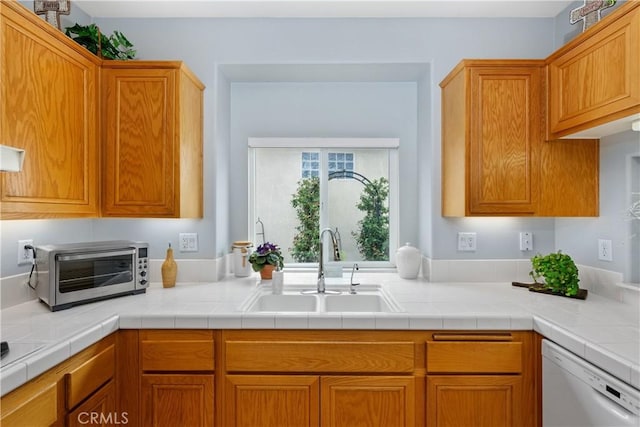 40310 Via Tonada, Murrieta, CA 92562 - kitchen with white dishwasher, a sink, brown cabinets, a toaster, and light countertops