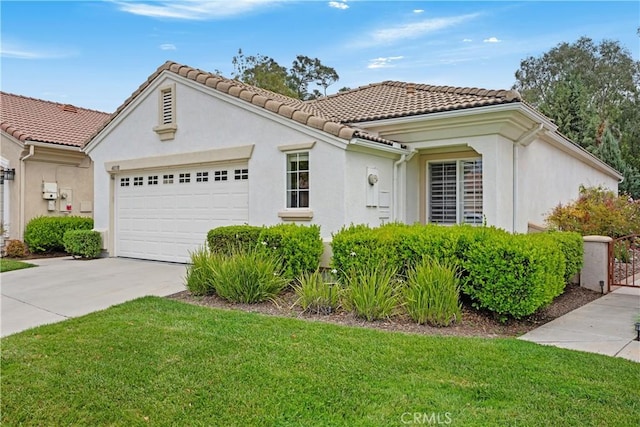 40310 Via Tonada, Murrieta, CA 92562 - view of front of house with stucco siding, a front lawn, driveway, and a garage