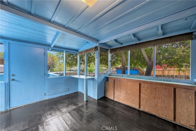 unfurnished sunroom featuring a healthy amount of sunlight