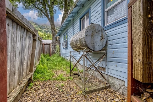 view of home's exterior with fence