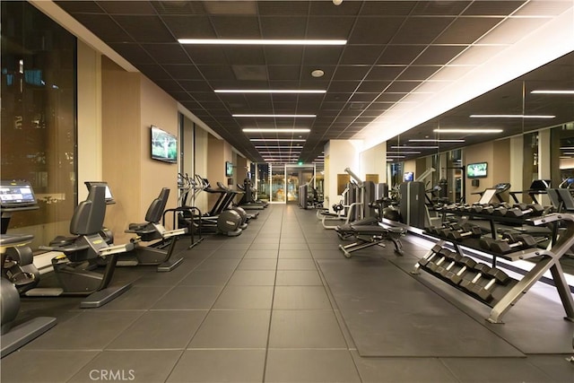 gym featuring a paneled ceiling