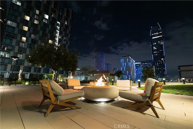 patio at twilight with a view of city lights