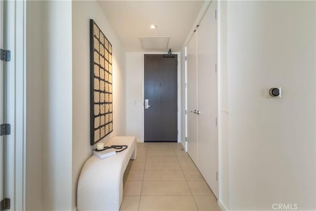 corridor featuring light tile patterned floors
